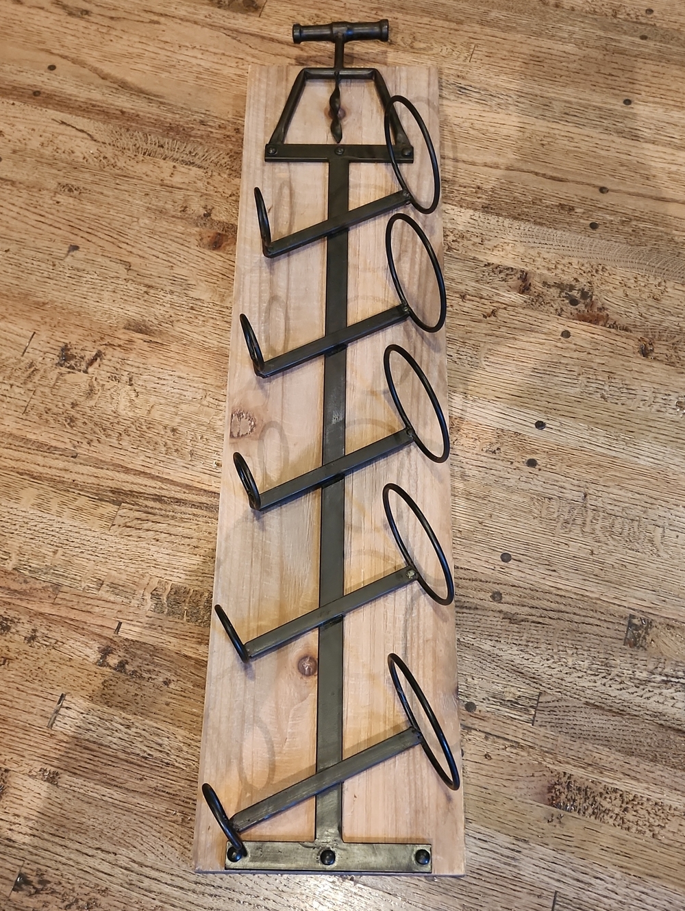 Rustic Metal Wall-Mounted Bottle Rack on Wood Backing